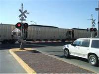 car at train crossing (select to view enlarged photo)